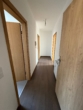 Flur mit Holztüren - Vermietete Bestandswohnungen im Grünen – Kapitalanlage in Spechthausen